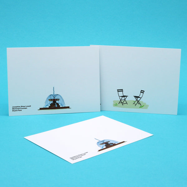 Writing cards with illustrations of a park fountain and outdoor chairs.