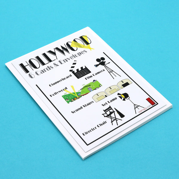 Writing cards with illustrations of famous film making tools like , sound stages, clapperboards and a director's chair.