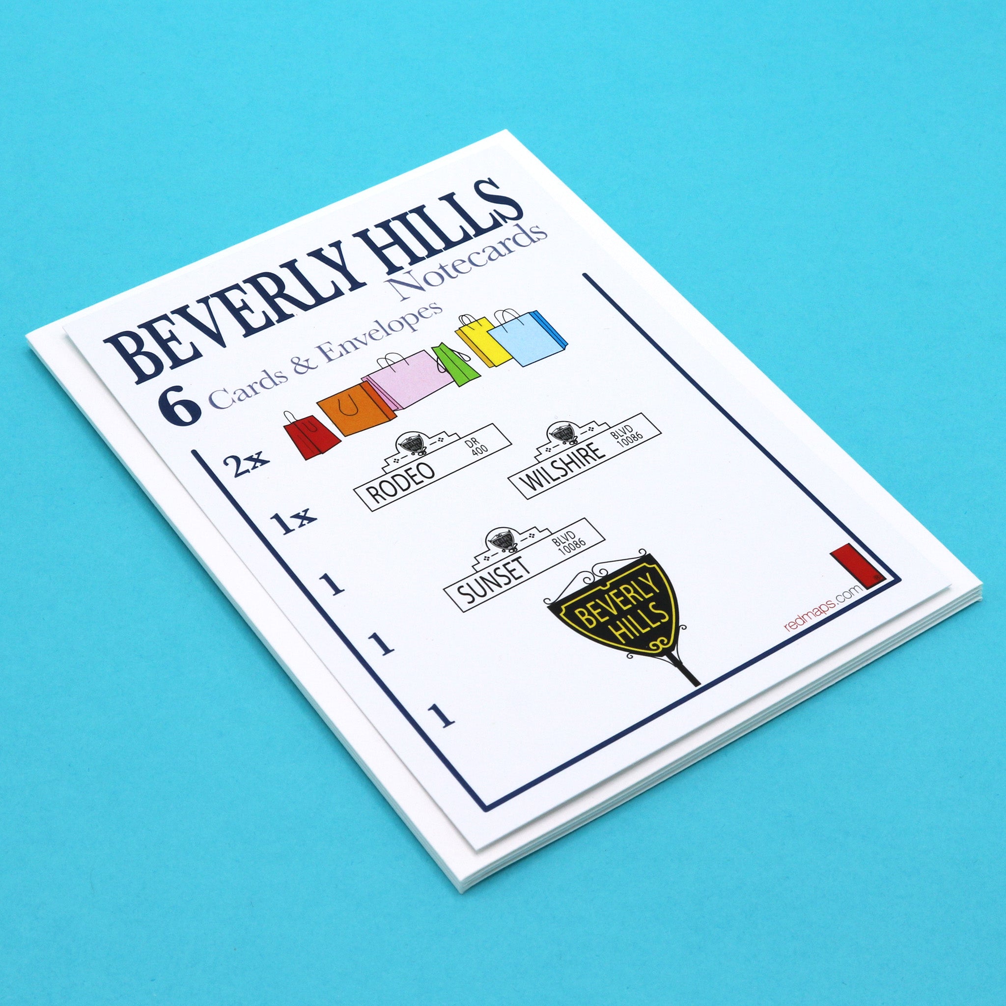 Set of notecards with illustrations of famous Beverly Hills streets and shopping bags.