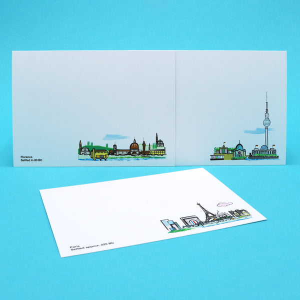 Notecards with illustrations of Berlin, Paris and Florence skylines and landmarks.