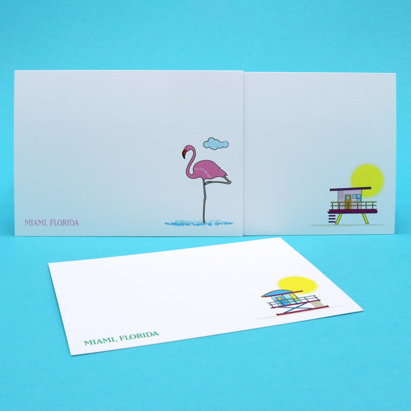Writing cards with illustrations of colorful lifeguard stations and a pink Flamingo.