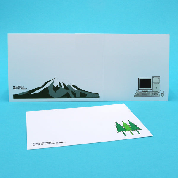 Writing cards with illustrations of Seattle's Mt. Rainier, Douglas fir trees and other Seattle iconic landmarks.