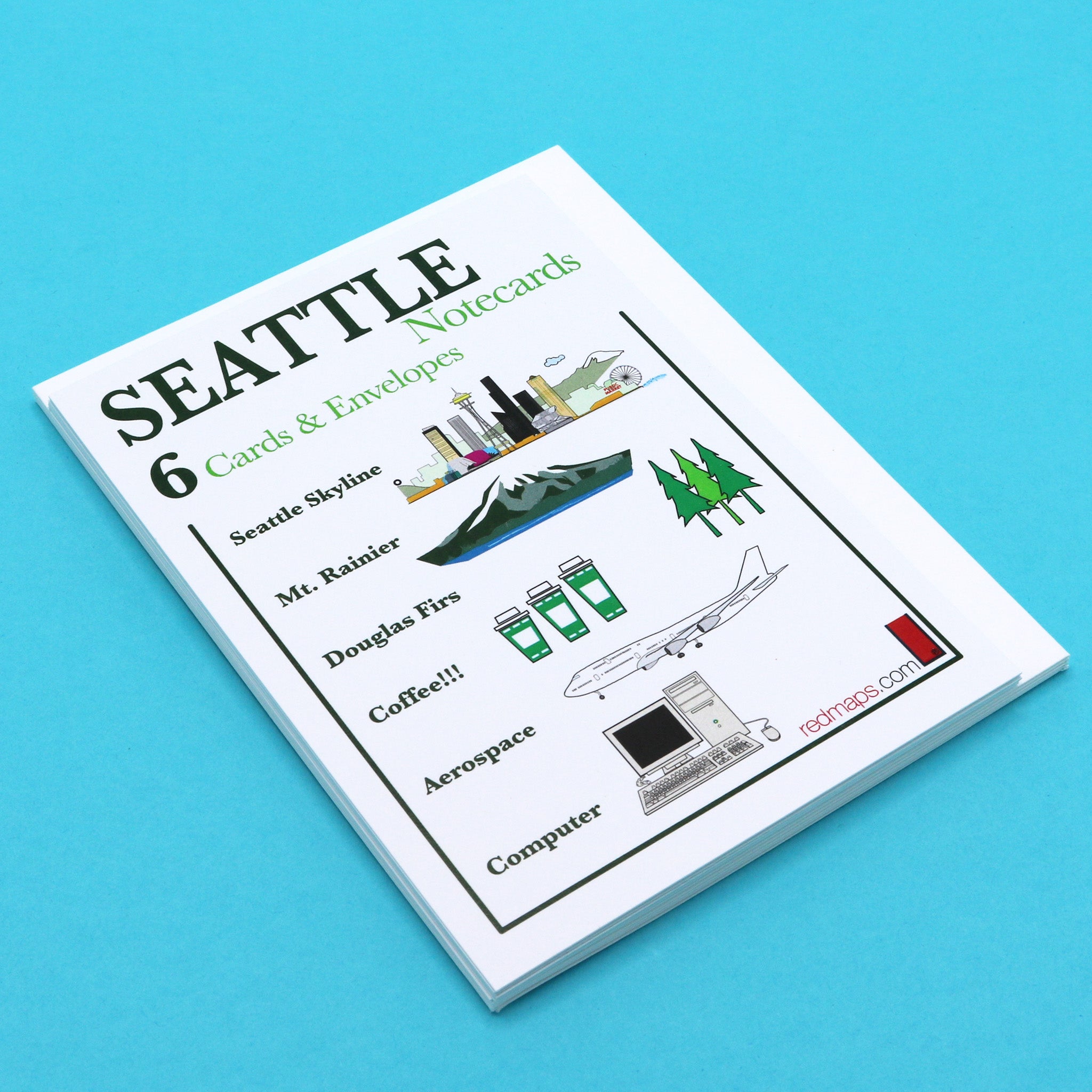 Writing cards with illustrations of Seattle's famous landmarks, skyline and iconic tech inventions.